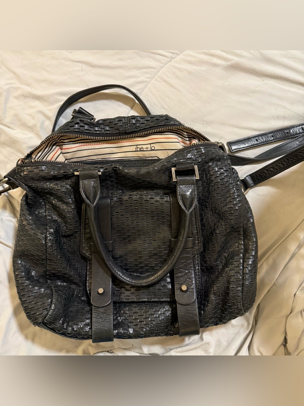 She + Lo Black Woven Leather Duffel Bag with Top Handles and Detachable Strap